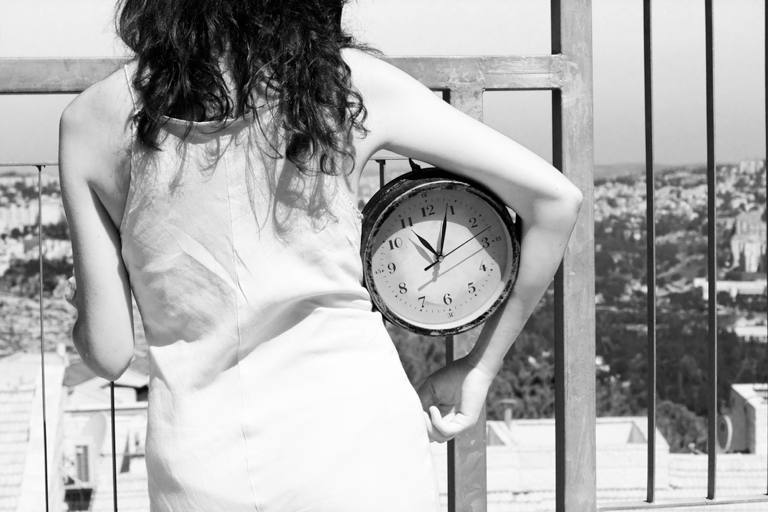 Girl with clock under her arm