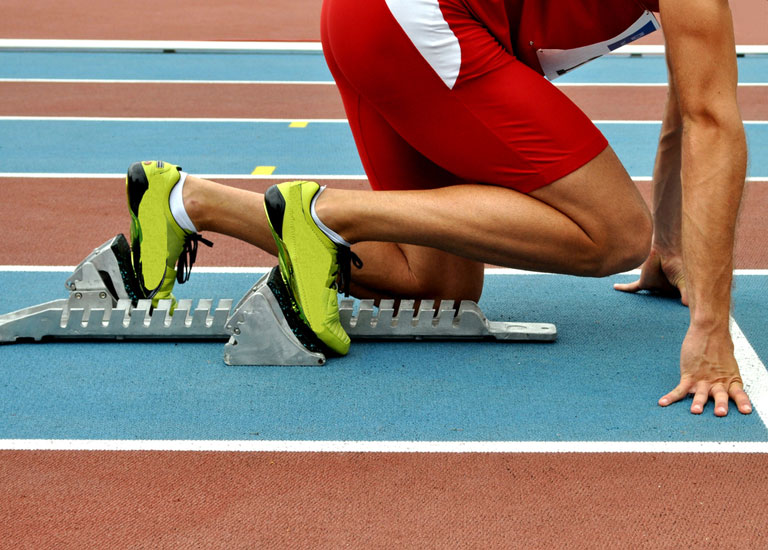 Runner in starting blocks