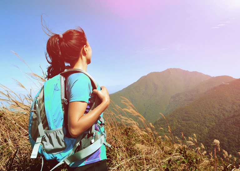 single woman hiking