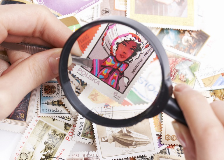 Stamp viewed via magnifying glass