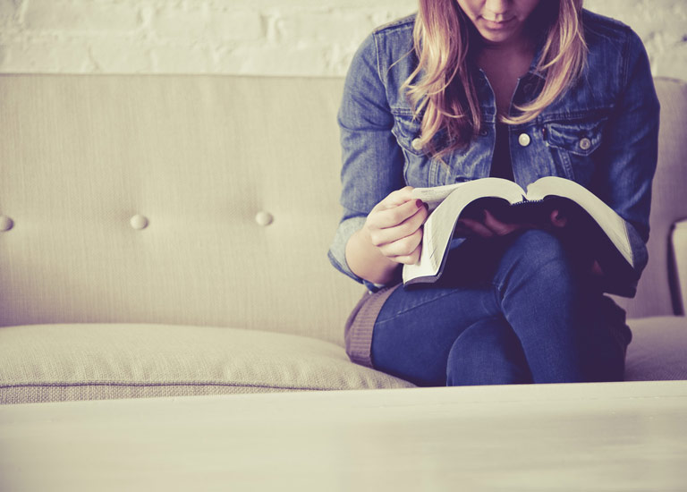 Girl reading The Bible