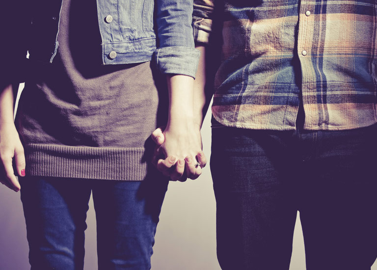 A couple holding hands