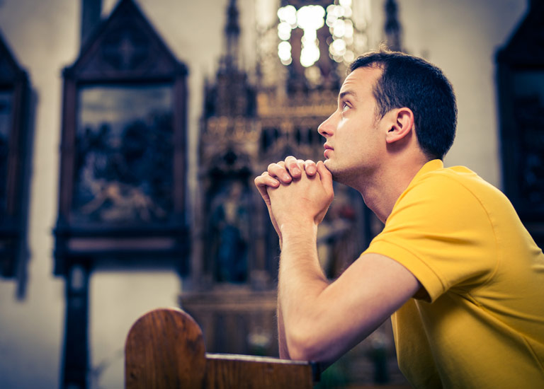 Man praying in church