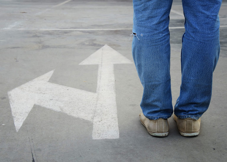 Man standing at crossroads