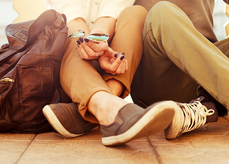 A couple sitting on the ground together