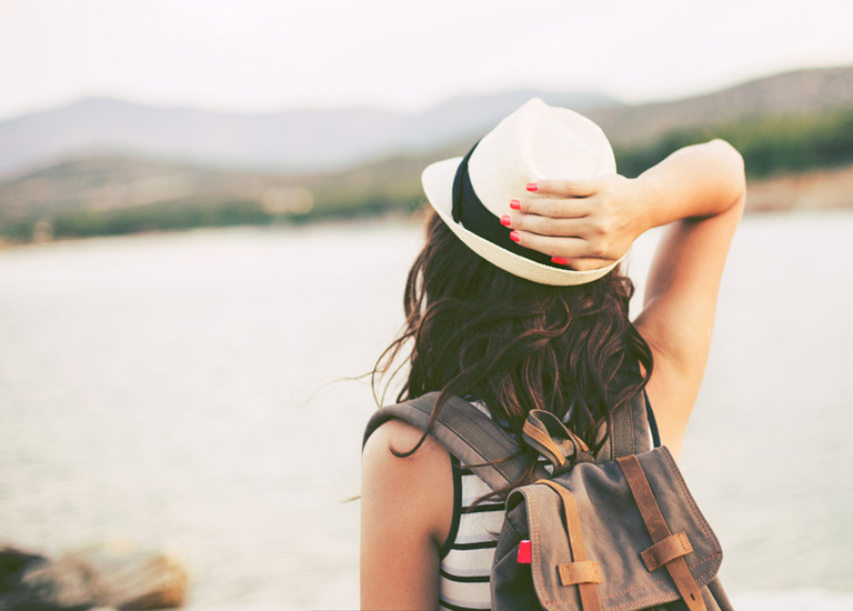 Woman looking out at a lake