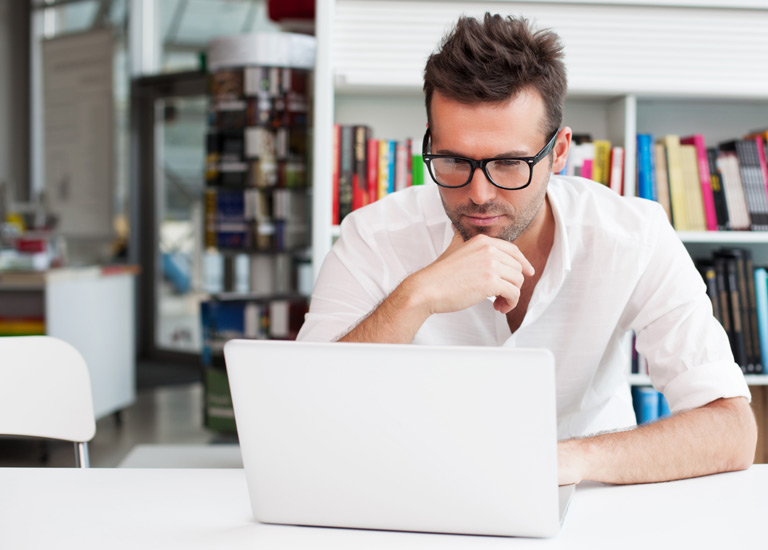 Man looking at a laptop