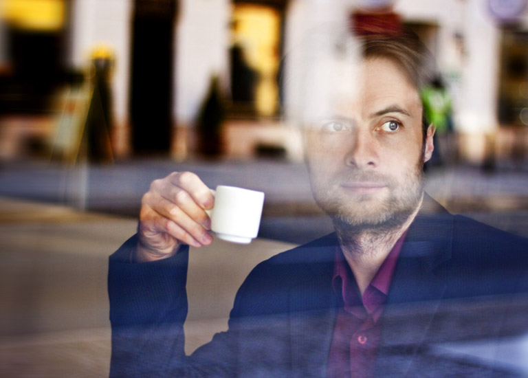 Man waiting in coffee shop