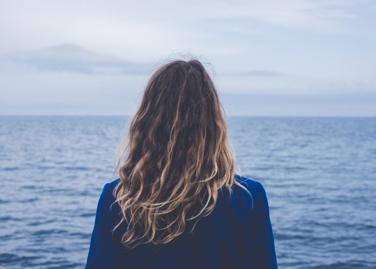 Woman looking out to sea