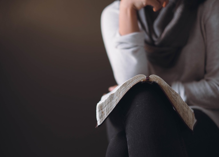 A woman reading the Bible