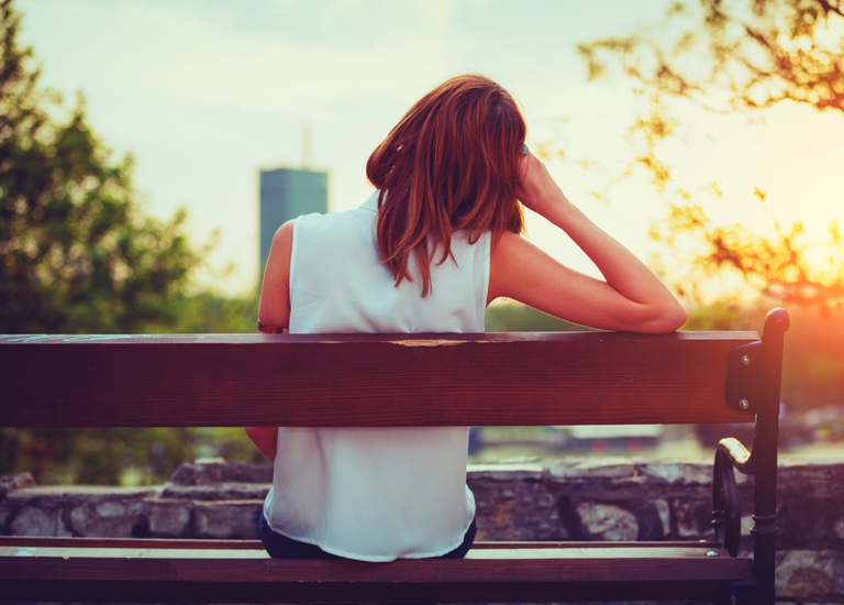 Woman sat on a bench