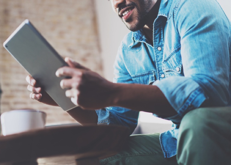 Man looking at a tablet