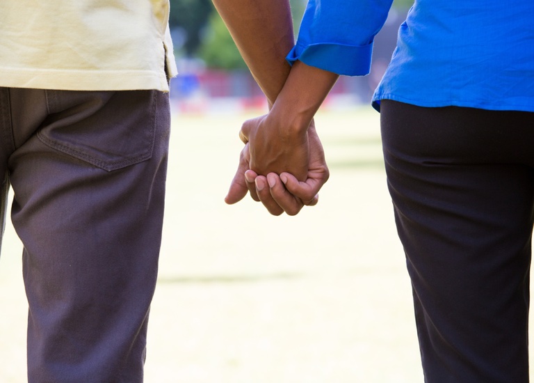 A couple holding hands