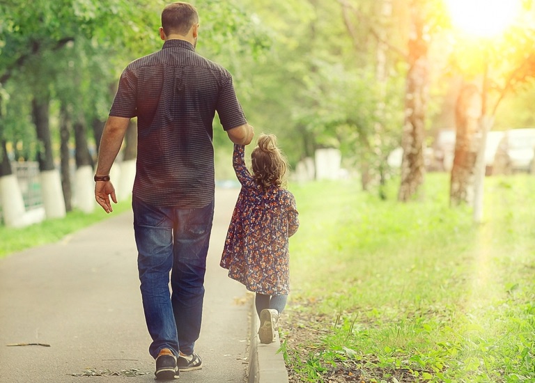 Father holding his child's hand