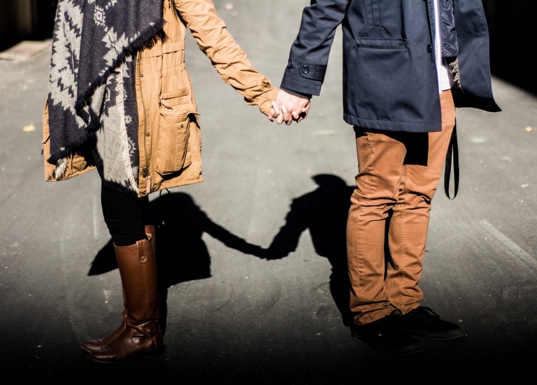 Couple holding hands