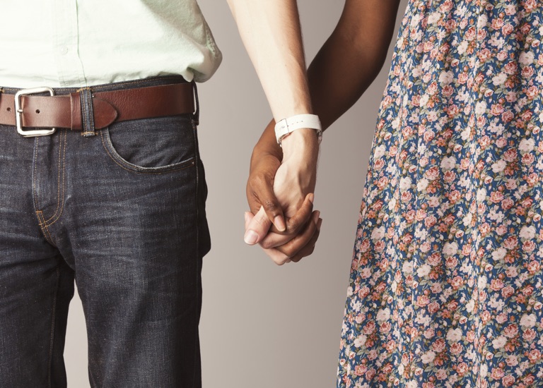 Couple holding hands