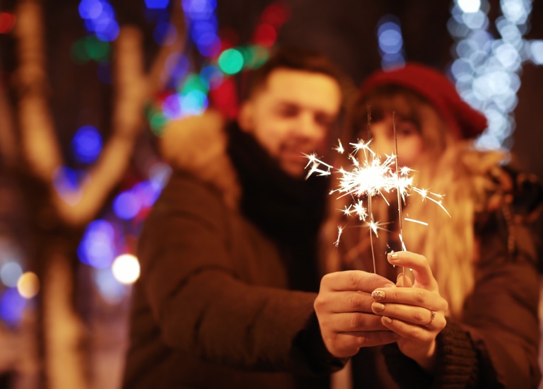 A couple holding a sparkler