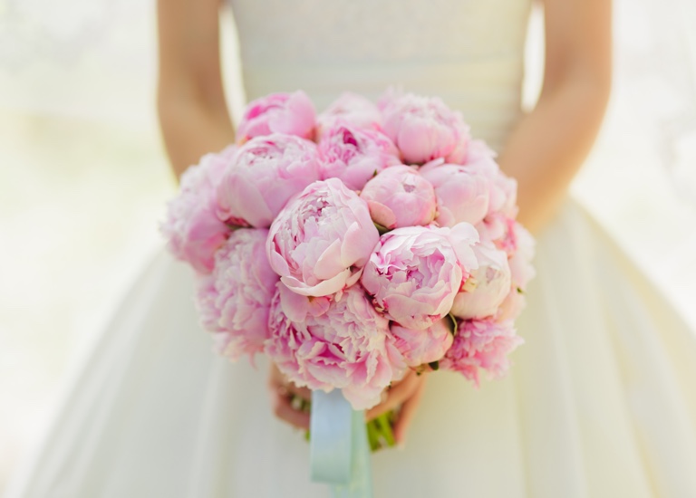 Woman holding a bouquet of flowers