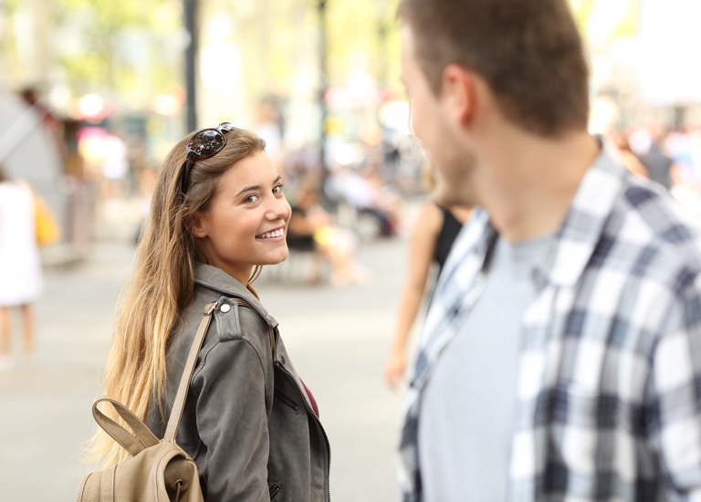 Man and woman flirting