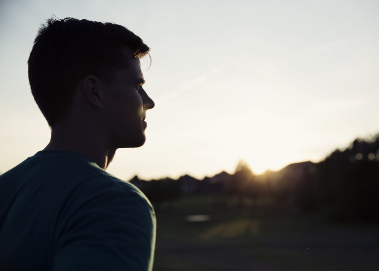 Man looking pensive in the sunset