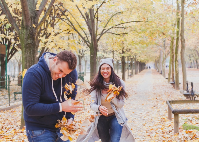 Playing together in the autumn-fall leaves