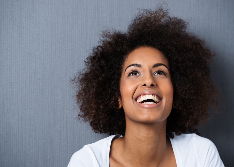 Laughing woman looking up