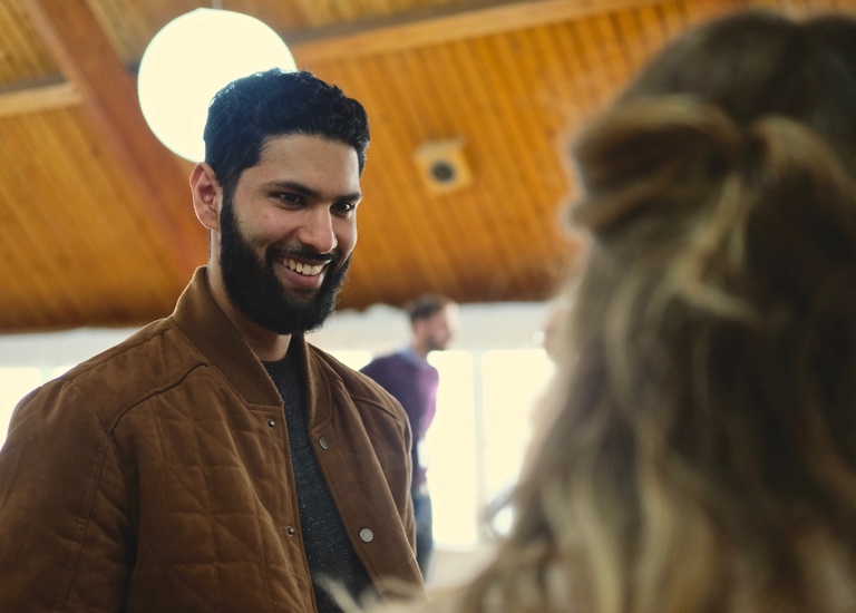 A man and woman talking in church