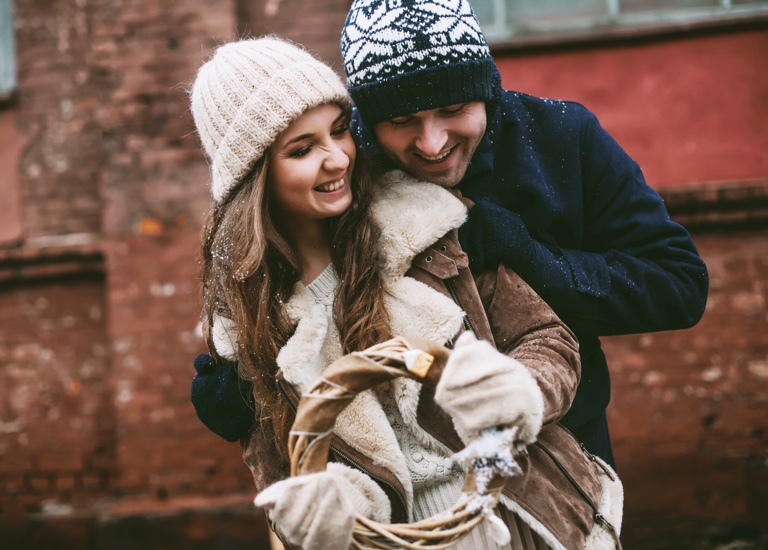 A couple wearing wooly hats