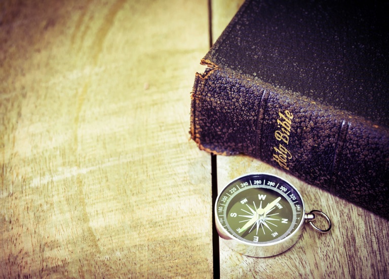 Image of a Bible and compass