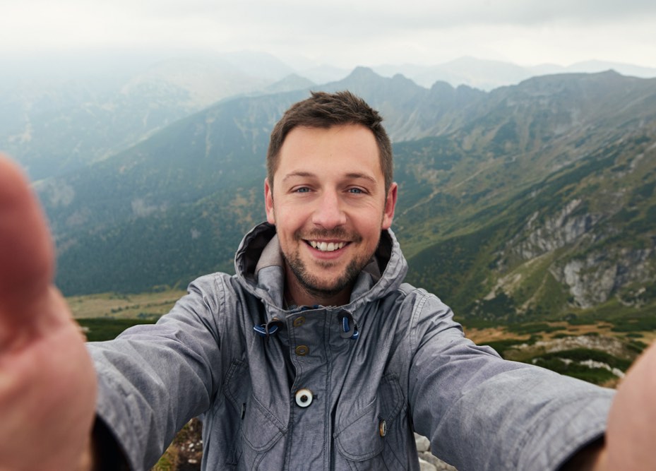 Man on mountain enjoying new year nature