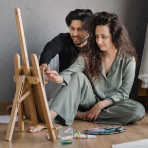 A couple painting together