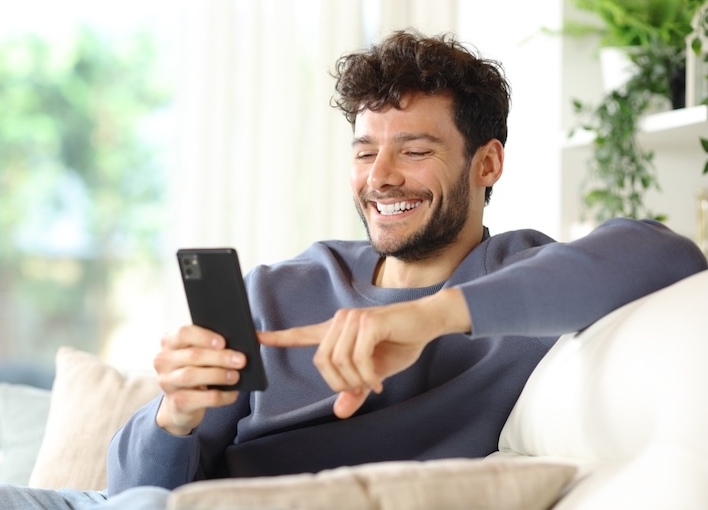 Why a positive dating profile will change your Christian Connection experience - Christian Connection blog - man on smartphone