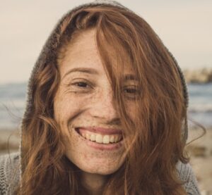 Woman smiles at camera - best dating profile photos - Christian Connection blog