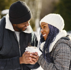 Man and woman enjoying seasonal walk - Christian Connection blog - 6 joyful Christmas date ideas to celebrate the season