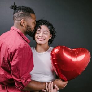 Couple with heart balloon - 3 ways to make Valentine’s Day a catalyst for change - Christian Connection blog