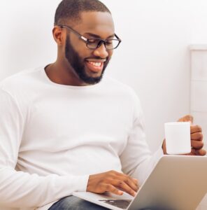 Man using laptop - 'How staying active on Christian Connection increases your chances of connecting' - Christian Connection blog