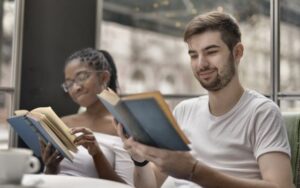 Young woman and men reading books together - Why being authentic (and specific!) online leads to the best connections - Christian Connection blog
