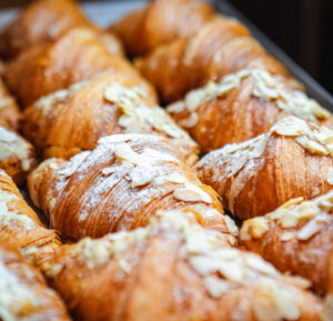 Tray of almond croissants - 6 delicious food date ideas for a memorable connection - Christian Connection blog