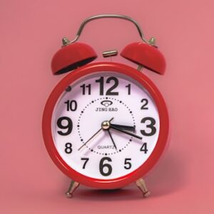 Red alarm clock - How to learn to trust God’s timing - Christian Connection blog. Image: Andrea Hajdu / Unsplash