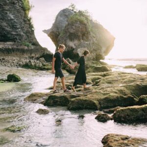 man and woman on rocky beach - Date ideas in nature to enrich your time together - Christian Connection blog