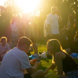Man and woman chatting in low sunlight - 6 simple ways to connect at festivals - Christian Connection blog