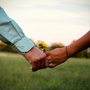Two people holding hands - 'Five stars and finding love – What our members are saying about Christian Connection'